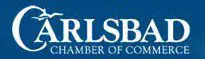 A blue banner with the words carlsbad chamber of commerce in white.